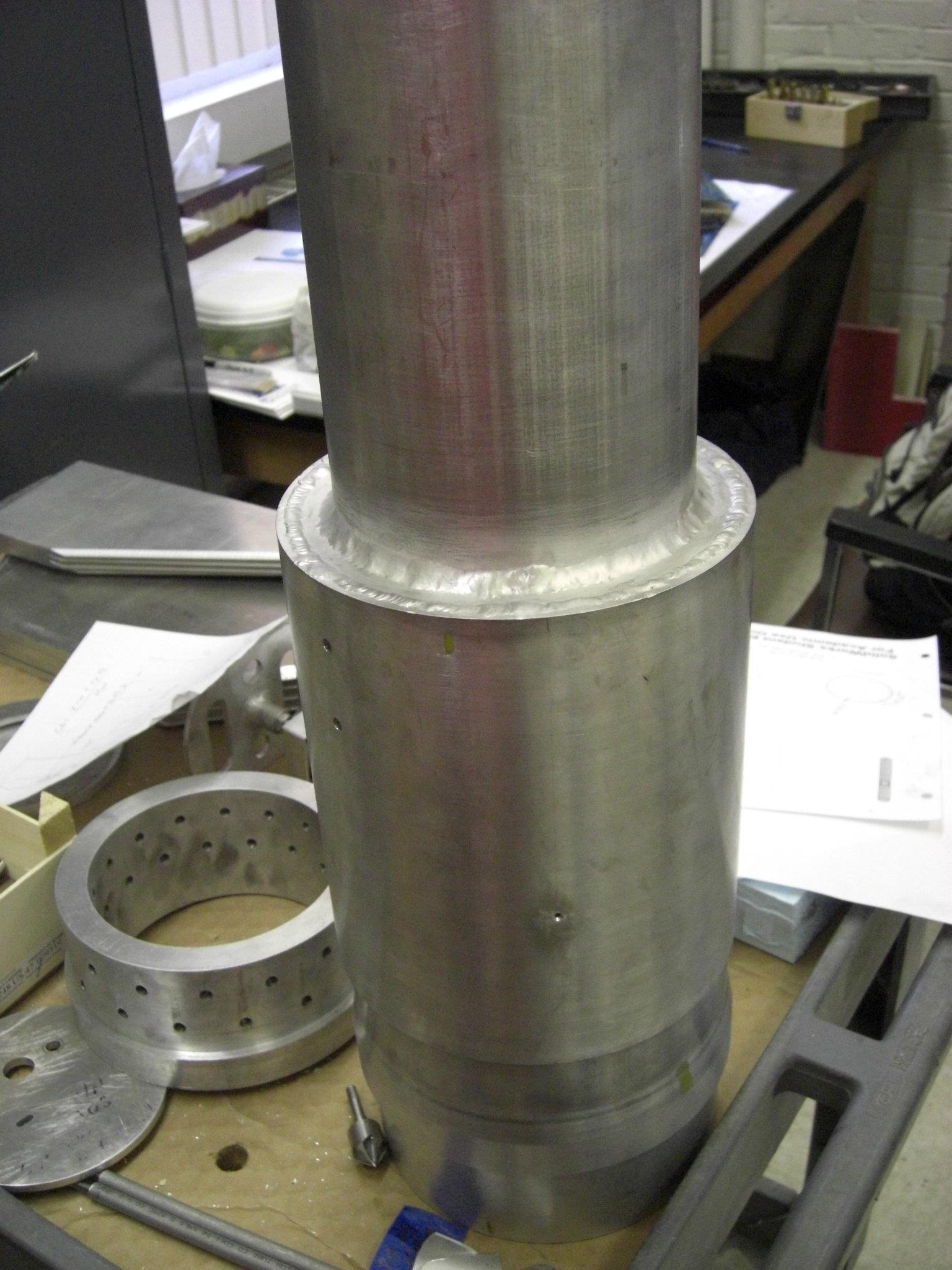 Several welded tubes sitting in the lab shortly after completion